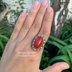 This beautiful oxtail red Coral Ring is set in 14k solid gold and a fancy diamond granulated setting! Ring Size: 7.25 Total Weight: 17.17 grams Precious Metal: 14k solid gold Precious stones: -Coral Center Stone: 20mm x 11mm -White Round diamonds: 0.4 ct Heirloom Red Oval Cluster Ring, Victorian Oval Red Diamond Ring, Victorian Style Red Oval Diamond Ring, Red Victorian Diamond Ring, Antique Oval Red Diamond Ring, Antique Red Oval Diamond Ring, Heirloom Red Oval Diamond Ring, Formal Red Cluster Ring With Diamond Accents, Heirloom Red Diamond Ring With 17 Jewels