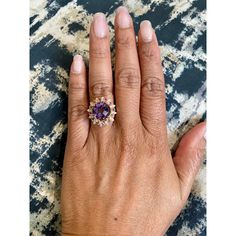 Amethyst, Pink Sapphire, and Diamond Cocktail Ring!  Playful yet Powerful! Its like having a piece of glittery candy on your finger! This ring has a Checkers Round Cut Amethyst that weighs 4.90 Carats and is embellished with alternating 12 Pink Sapphires that weigh 0.28 Carats and 12 Round Cut Diamonds that weigh 0.20 Carats. (Clarity: SI2, Color:F) The total carat weight of the ring is 5.38 Carats.  The ring is crafted in 14 Karat Yellow Gold and weighs approximately 4.8 grams. The ring is a si Fine Jewelry Amethyst Ring With Accent Stones For Promise, Dazzling Amethyst Diamond Ring, Amethyst Diamond Ring With Gemstone Accents For Promise, Purple Center Stone Jewelry For Promise, Purple Jewelry With Center Stone For Promise, Promise Amethyst Crystal Ring With Center Stone, Amethyst Open Ring With Accent Stones, Amethyst Crystal Promise Ring With Center Stone, Heirloom Amethyst Rings With Gemstone Accents