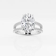 a round cut diamond ring with pave set shoulders