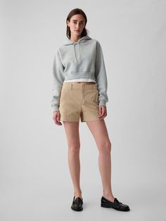 Soft stretch cotton khaki shorts.  Concealed hook and bar closure, zip fly.  Front slant pockets.  Back welt pockets.  This pair of shorts is part of our water-saving Washwell program.  Compared to conventional wash methods, Washwell has saved millions of liters of water since 2016.  Mid rise.  Easy through the hip and thigh.  Inseam: 4" 10 cm) Model is approx.  5’10” wearing Grey Tshirt, Gap Shorts, Support People, Khaki Shorts, Petite Size, Calgary, Stretch Cotton, Mid Rise, Gap