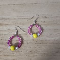 Handmade Glass And Acrylic Faux Pearl Earrings Quarter Photographed For Scale Trendy Yellow Drop Earrings, Handmade Yellow Drop Hoop Earrings, Yellow Single Dangle Earring, Single Yellow Dangle Earring, Casual Handmade Yellow Earrings, Trendy Yellow Earrings With Ear Wire, Yellow Drop Hoop Earrings As Gift, Trendy Yellow Beaded Dangle Earrings, Adjustable Yellow Beaded Earrings With Ear Wire