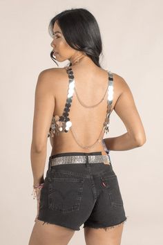 Add some sparkle to your style with the Kacey Glimmer Top! This gold sequin crop top will make you shine at any festival (or just a night out). With two adjustable straps, this one-size-fits-most top is perfect for any party-goer looking to stand out. Summer Sequined Backless Halter Top, Sequined Backless Halter Top For Summer, Backless Sequined Halter Top For Summer, Sequin Halter Top For Summer Party, Summer Party Sequined Halter Top, Metallic Halter Top For Summer Party, Glamorous Backless Tank Top For Summer, Summer Party Metallic Halter Top, Metallic Cropped Disco Crop Top