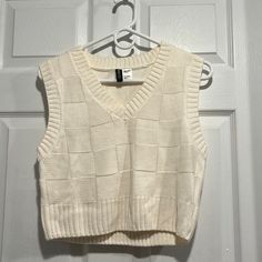 H&M White Sweater Vest. Never Worn. Size Small. White Cotton Sweater Vest For Fall, H&m Cotton Sweater For Spring, H&m White Sweater For Spring, Casual Fitted Cream Vest, H&m White Spring Sweater, White Fitted Outerwear By H&m, Fitted Cream Sweater Vest Casual, White Sweater Vest, Sweater Vests