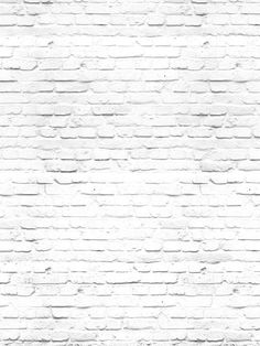 an old brick wall with white paint