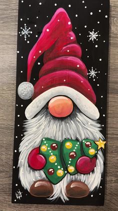 a painting of a santa clause holding a christmas stocking with snowflakes on it