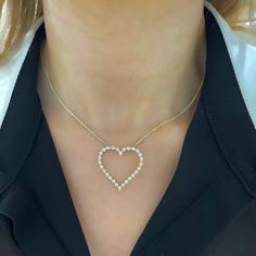 Our Posie Charlie Floating Diamond Heart Necklace is the smallest of the Charlie Cloud Family and has a delicate and charming look! A heart setting houses round brilliant cut diamonds that dance along the neck to create a beautiful but subtle silhouette. This exquisite and elegant design is able to shine alone or can be perfectly layered with another dainty necklace. You’ll love to pair this with a band from the Charlie Cloud family! This necklace is handcrafted by our talented jewelers in our D Heart-shaped Cubic Zirconia Necklace With Prong Setting, Anniversary Open Heart Diamond Necklace With Single Cut Diamonds, Anniversary Open Heart Diamond Necklace, Diamond Heart Necklace With Prong Setting, Vvs Clarity Heart Pendant Diamond Necklace For Valentine's Day, Heart Shaped Diamond Necklace With Prong Setting For Wedding, Fine Jewelry Heart Necklace With Round Cut Cubic Zirconia, Fine Jewelry Heart-shaped Diamond Necklace, Fine Jewelry Diamond Necklace With Heart Cut