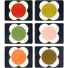 four different colored circles on black and white paper with red, green, yellow, and orange shapes