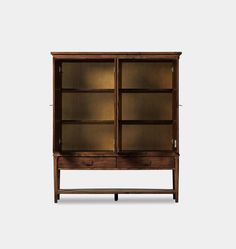 an old wooden cabinet with glass doors and drawers on the bottom, against a white background