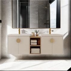 a bathroom vanity with two sinks and mirrors