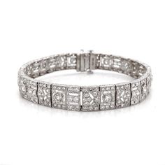 Slim vintage and Art Deco inspired diamond platinum link bracelet.  Adorned with white round cut diamonds in 8.69 carat total in stylized arrangements and patterned links. Diamonds are all natural in G-H Color Clarity VS.    Platinum 950 metal.  Length: 18 cm Width. 0.9 cm Weight: 32.8 g #maxjewelryinc #jewelry #jewelries #artdeco #retro #bracelet #accessories #fashion #bracelets #luxury #diamonds #diamond #bling #platinum #vintage Art Deco Formal Tennis Bracelet With Brilliant Cut, Formal Art Deco Tennis Bracelet With Brilliant Cut, Formal Art Deco Brilliant Cut Tennis Bracelet, Formal Art Deco Diamond Tennis Bracelet, Art Deco White Gold Tennis Bracelet With 17 Jewels, Art Deco Diamond Bracelets For Anniversary, Art Deco Diamond Jubilee Bracelet, Art Deco Diamond Tennis Bracelet With Single Cut Diamonds, Art Deco Diamond Tennis Bracelet With Brilliant Cut