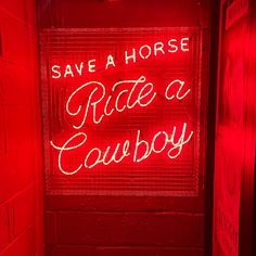 a neon sign that says save a horse ride a cowboy