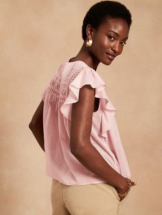 Soft with delicate pintucks, our lightweight ruffle-sleeve top is semi-sheer and made from 100% cotton for luxurious summer-day charm.  SWING FIT: Cut for a flowing, A-line fit.  No waist definition.  Crew neck with button-keyhole at back.  Straight Elegant Tops With Ruffle Hem For Day Out, Feminine Fitted Top With Pleated Sleeves, Feminine Summer Top With Smocked Back, Summer Feminine Top With Smocked Back, Feminine Summer Tops With Smocked Back, Spring Daywear Blouse With Flutter Sleeves, Feminine Top With Smocked Back And Flutter Sleeves, Chic Flowy Cotton Blouse, Summer Feminine Blouse With Ruffles