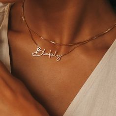 DAINTY SCRIPT NAME NECKLACE Personalized necklaces make the perfect gift for any occasion, so don't wait until it's too late! The new dainty handwriting font name necklace offers a beautiful take on a classic favorite, featuring beautifully rounded script letters for an elegant look. Finished with a matching box chain attached to each end for perfect balance. It's 100% waterproof and the color remains shiny for years! ITEM SPECIFICATIONS • Finish: 925 Sterling Silver ∙ 18K Gold ∙ Rose Gold• Dime Dainty Handwriting, Male Necklace, Script Letters, Script Necklace, Circle Bracelet, Classy Jewelry, Necklace Personalized, Minimalist Necklace, Everyday Jewelry