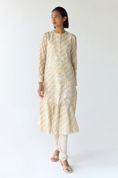 Cloud beige cream kurta with frilled hem, striped, floral hand block prints, fabricated, sequins and thread floral embroidery. Comes with churidar and scarf. - Aza Fashions Designer Cream Kurta With Floral Embroidery, Cream Kurta With Floral Embroidery For Festive Occasions, Festive Cream Kurta With Floral Embroidery, Cream Straight Kurta For Spring, Cream Kurta With Floral Embroidery For Diwali, Beige Kurta With Chikankari Embroidery For Spring, Cream Traditional Wear With Resham Embroidery For Spring, Beige Chikankari Embroidered Kurta For Spring, Cream Embroidered Kurta For Spring