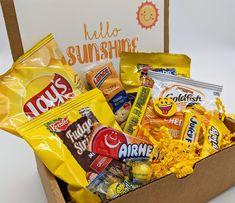 an open box filled with snacks and candy