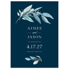 an elegant blue wedding card with leaves on it