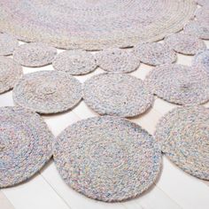 several circular rugs are laid out on the floor