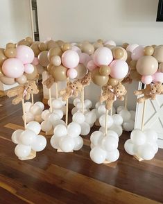 balloons are arranged in the shape of animals on sticks