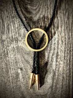 "Brass bolo, round in shape. Custom, one of a kind Bolo tips hand milled in Washington!  PLEASE HELP OUT ARTISTS AND CREATORS Etsy just jacked up all their fees through the roof and I literally can't make this item for any less than it already is. Submit feedback to Etsy about fees and I will gladly drop all of my prices! Each handmade bolo has a unique metal patina giving you a one of a kind piece. The finish is not painted, but actually a chemical reaction/oxidation so the finish becomes part of the base metal. Once the desired look is achieved, I neutralize and seal the patina so it does not continue to change and oxidize...though on the right metal this can be great!  You can dress this up or wear casual with a t-shirt. Either way people will definitely notice this unique piece. PLEASE Modern Bolo Tie, Western Style Gold Lariat Jewelry, Adjustable Gold Bolo Tie As Gift, Gold Lariat Bolo Tie With Adjustable Length, Handmade Western Style Gold Jewelry, Handmade Western Gold Jewelry, Hand Tooled Artisan Gold Jewelry, Adjustable Circle-shaped Hand Forged Jewelry, Adjustable Circle-shaped Hand-forged Jewelry