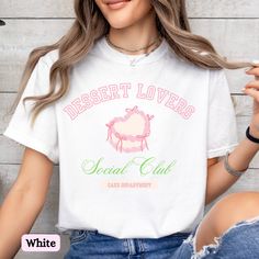 Rep your love for dessert and cake with this Dessert Lovers (Cake Department) tee. This shirt is a perfect versatile addition to your wardrobe whether you're running errands, having brunch with friends, enjoying a theme park, or taking a baking class.  ✨ This shirt has a relaxed fit -- for a trendy oversized look we recommend sizing up, for a closer fit we recommend sizing down or staying true to size. Consult our size chart and color palette for more detailed sizing and color options. ✨ Please note, the design is scaled to the t-shirt size, so on smaller shirts the design itself may appear smaller. 🎀 Comfort Colors is a premium, soft tee that is garment dyed for a vintage look. Due to this, there may be slight variations in color.  🎀 The Comfort Colors 1717 tee is made with medium fabri Cake T Shirt, Sweet White T-shirt With Graphic Print, Sweet White Short Sleeve T-shirt, Sweet White T-shirt With Funny Print, White Sweet T-shirt With Funny Print, Sweet Letter Print T-shirt For Gift, Sweet Crew Neck T-shirt For Gift, Shirt Cake, Friends Enjoying