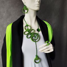 Beautiful playful spiral necklace in green shades with crystal glass. Long, elegant, rich in shapes.  Gorgeous stylish bohemian necklace. Eye catching artistic jewelry. Necklace is soft and light, very comfortable to wear. Dimensions: - Necklace length: 23" / 59cm (around neck). - Earrings length: 2"/ 5cm; Total drop length: 2.8"/ 7cm. - Ring size by order Options: - Choose jewelry or jewelry set options. Please contact me for any additional information you need or if anything is unclear. I'm here for you. Thank you for visiting my shop. Have a nice day :) Elegant Green Long Necklace As Gift, Unique Green Adjustable Necklace, Green Handmade Modern Jewelry, Handmade Green Beaded Lariat Necklaces, Handmade Green Lariat Beaded Necklace, Modern Green Handmade Jewelry, Modern Handmade Green Jewelry, Handmade Modern Green Jewelry, Modern Handmade Spiral Jewelry