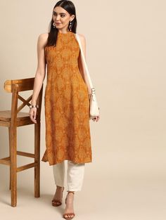 *Women Yellow Bandhani Printed Kurta * Colour: yellow * Bandhani printed * Round neck * Sleeveless, no sleeves * Straight shape with regular style * Calf length with straight hem *Fabric:-  Top: Rayon  Bottom: Cotton  Wash Care:- Hand Wash AVAILABLE IN 6 SIZES THEY ARE IN FOLLOWING MEASUREMENTS IN INCHES:- XS:- Bust-34/Waist-26/Shoulder-13.5/Length-45 S:- Bust-36/Waist-28/Shoulder-14/Length-45 M:- Bust-38/ Waist-30/Shoulder-14.5/Length-45 L:- Bust-40/Waist-32/Shoulder-15/Length-45 XL:- Bust-42/W Casual Yellow Kurta With Printed Motifs, Casual Orange Kurta For Summer, Festive Yellow Sleeveless Kurta, Summer Orange Kurta With Printed Motifs, Summer Yellow Kurta With Block Print, Summer Yellow Block Print Kurta, Yellow Bandhani Print Kurta For Summer, Summer Yellow Bandhani Print Kurta, Casual Yellow Straight Kurta