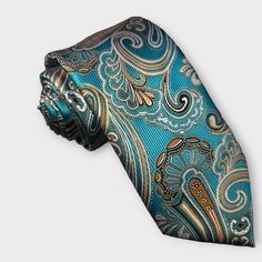 The tie is expertly crafted, with a sleek design that is perfect for a professional look. The pocket square is made with the same silk material and features the same vibrant paisley design, making it the perfect match for the tie. The cufflinks feature a subtle paisley design, adding a subtle touch of style to your formal attire. 100% Silk Handmade Package Includes: Tie, Pocket Square & Cufflinks. Length: 59" Width: 3.34" Warm iron if needed Formal Patterned Paisley Suit And Tie Accessories, Elegant Multicolor Neckwear For Business, Elegant Multicolor Formal Neckwear, Elegant Multicolor Business Neckwear, Elegant Multicolor Pocket Square For Formal Wear, Elegant Multicolor Pocket Square For Formal Occasions, Elegant Paisley Print Tie As A Gift, Elegant Paisley Print Ties As Gift, Elegant Multicolor Formal Pocket Square