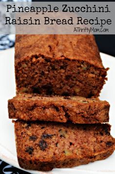 two slices of pineapple zucchini raisin bread are on a white plate