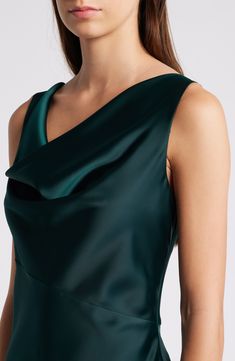 Glossy green satin starts the style story for a bias-cut gown designed with a draped neckline. 60" length (size Medium) Cowl neck Sleeveless 97% polyester, 3% spandex Dry clean Imported Green Cowl Back Dress For Party, Green Cowl Back Party Dress, Green Draped Satin Evening Dress, Green Silk Satin Dress For Formal Occasions, Fitted Green Satin Dress Bias Cut, Green Evening Dress With Bias Cut, Green Cowl Back Dress, Green Satin Finish Formal Evening Dress, Green Bias Cut Evening Dress