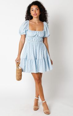 Get ready to feel fabulous in the Kendall Blue Eyelet Puff Sleeve Mini Dress! It's sure to bring a playful and fun vibe to your wardrobe. This puff sleeve mini dress is made from blue and cream pierced eyelet lace fabric, with a smocked corset-inspired bodice, a square neckline, and an attached tiered mini skirt. Style with heels for an elevated look! DETAILS & FIT S: 30" length, 25" waist, 32" bust M: 30.5" length, 27" waist, 33" bust L: 31" length, 29" waist, 35" bust 100% Cotton. Machine wash Cotton Mini Dress For Brunch, Light Blue Square Neck Mini Dress With Ruffles, Light Blue Mini Dress With Ruffles And Square Neck, Cute Puff Sleeve Mini Dress For Brunch, Blue Flirty Mini Dress With Square Neck, Cute Fitted Mini Dress With Puff Sleeves, Flirty Puff Sleeve Mini Dress For Summer, Flirty Summer Puff Sleeve Mini Dress, Flirty Blue Mini Dress With Square Neck