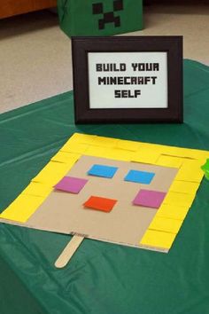 a table with a sign that says build your minecraft self