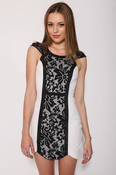 Embroidered lace overlay dress.
Black lace and trim.
Capped sleeves.
Thick stretchy fabric.
Notched front hem.
Side invisible zip.
Cotton/Polyester.
Available in black, neon peach. Black Stretch Dress With Lace Patchwork, Fitted Sleeveless Lace Dress With Contrast Lace, Fitted Cap Sleeve Dress With Lace Bodice, Fitted Lace Bodice Dress With Cap Sleeves, Spring Fitted Mini Dress With Contrast Lace, Lace Mini Dress With Stretch Lace Sleeves, Stretch Lace Mini Dress With Lace Sleeves, Stretch Mini Dress With Lace Sleeves, Black Mini Lace Dress With Contrast Lace