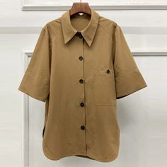 This is perfect for those who are looking for a clothing for a good price. It is fashionable, stylish, and it will look great on anyone who wears it. Do you wanahavit? SIZE S:Shoulder:43cm,Bust:100cm,Sleeve Length:35cm,Length:76cm M:Shoulder:44cm,Bust:104cm,Sleeve Length:36cm,Length:77cm L:Shoulder:45cm,Bust:108cm,Sleeve Length:37cm,Length:78cm Note: 1 inch = 2.54 cm, 1 cm = 0.39 inch note: measurement by hands allow 2-4cm errors which is normal Casual Half Sleeve Office Tops, Spring Office Wear Solid Color Shirt, Collared Solid Color Cotton Blouse, Lapel Collar Tops For Workwear, Solid Button-up Tops For Workwear, Solid Color Half Sleeve Office Top, Chic Cotton Blouse With Lapel Collar, Office Half-sleeve Solid Color Tops, Fall Blouse With Lapel Collar For Day Out