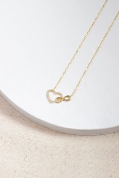 Love can be found even in the smallest details. This infinity heart necklace may seem like a small detail, but it definitely carries the biggest meaning. It is the most elegant representative of immortal love. DETAIL * Made to order. * 100% 14K Solid Gold * Gold Color Selection: Yellow Gold, Rose Gold, White Gold * Cubic zirconia * Pendant Lamp Height: 21 mm / 0.82 inch * Pendant Width: 12 mm / 0.47 inch * Length: 14", 16", 18", 20", 22" (I have a little note in the photos that may help you.) * Ready to Ship in 1-3 Business Days * 100% sourced from the USA * Free returns within 14 days from order date A B O U T ∙ U S * All customization is done by hand. Because it's better this way. * 100% Ethically Sourced, USA raw materials * Our beautiful packaging was created with love and fun on a mot Gold Infinity Necklace For Anniversary Gift, Gold Infinity Necklace For Anniversary, Elegant Necklace With Adjustable Chain For Anniversary Gift, Elegant Heart Necklace With Adjustable Chain For Anniversary, Infinity Necklace With Delicate Chain For Wedding, Dainty Infinity Necklace With Delicate Chain, Anniversary Heart Necklace With Delicate Chain, Elegant 14k Gold Infinity Necklace, Infinity Heart Charm Necklace For Valentine's Day