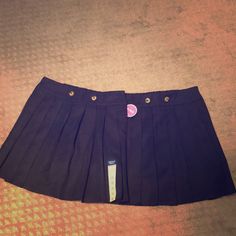 Navy Blue Pleated Skirts With Shorts Underneath. Elastic Waist On The Back. New But Only One Has The Tag Attach. Never Worn. Pleated Short Mini Skirt For School, Skirted Skort With Pockets For School, School Skort With Pockets, School Mini Skirt With Lining, Preppy School Skirt Bottoms, Short Pleated Mini Skirt For School, School Uniform Tennis Skirt In Mini Length, School Uniform Mini Skirt With Lining, Short Cotton Skort For School