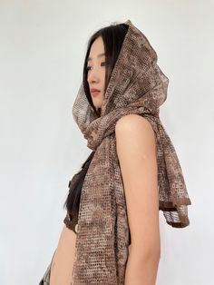 Transform your look with a sheer touch of elegance; our Sheer Mesh Metallic Thread Snakeskin Print Scarf is the perfect balance of sophistication and edge.
Meticulously crafted from delicate polyester mesh with a subtle metallic sheen, this scarf boasts a unique snakeskin pattern that's both contemporary and versatile. The lightweight design ensures a comfortable wear, while the multifunctional nature offers style adaptability to suit various occasions.
Ideal for those who appreciate nonchalant Snakeskin Pattern, Snakeskin Print, Metallic Thread, Scarf Print, Snake Skin, Army Green, Thread, Mesh, Pattern