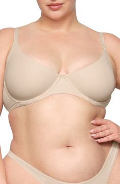 Enjoy the comfort of a bralette while retaining the support of an underwire with this comfortable everyday option. Available in many different shades, this second-skin bra is updated with a straighter, bonded neckline with no stitching to allow the 360º stretch fabric to lay flat against your skin. Adjustable straps 80% polyamide, 20% elastane Hand wash, dry flat Imported lined No-show Padded Bra, Supportive Underwire Bra In Beige, Classic Underwire Bra With Soft Touch, Beige Seamless Underwire Nursing Bra, Beige Underwire Nursing Bra With Medium Bust Support, Fitted Beige Nursing Bra With Soft Touch, Solid Shaping Underwire Bra, Beige Underwire Seamless Bra, Classic Nursing Bra