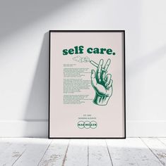 a poster with the words self care on it in green and white, against a white wall