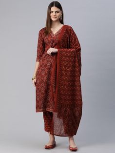 Women Floral Printed Regular Pure Cotton Kurta with Trousers & With Dupatta PRODUCT DETAILS  Red printed Kurta with Trousers with dupatta Kurta design: Floral printed Straight shape Regular style V-neck, three-quarter regular sleeves Zari detail Calf length length with straight hem Pure cotton machine weave fabric Trousers design: Printed Trousers Elasticated waistband Drawstring closure Size & Fit Size worn by the model: S Chest: 32" Waist: 29" Hips: 38" Height: 5'8" Material & Care Kurta Fabric: Cotton Bottom Fabric: Cotton Dupatta Fabric: Cotton Wash Care: Machine Wash Specifications Sleeve Length Three-Quarter Sleeves Top Shape Straight Top Type Kurta Bottom Type Trousers Dupatta With Dupatta Top Pattern Printed Top Design Styling Regular Top Hemline Straight Top Length Calf Length Nec Red Traditional Drape Sets With Printed Motifs, Red Sets With Printed Motifs In Traditional Drape, Red Sets With Printed Motifs And Traditional Drape, Fitted Red Bandhani Print Palazzo Set, Red Printed Motifs Sets For Navratri, Fitted Red Palazzo Set With Printed Motifs, Red Cotton Palazzo Set With Traditional Drape, Red Block Print Palazzo Set For Eid, Red Straight Kurta Set With Kalamkari Print