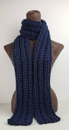 This scarf will keep you cozy and stylish in cold Winter weather. Measures 70 inches long and 5 inches wide. Can be worn multiple ways. Made with a chunky wool blend yarn for warmth and easy care. Machine washable. Blue Winter Scarf, Crochet Winter Scarf, Navy Blue Scarf, Crochet Winter, Chunky Wool, Blue Scarf, Winter Weather, Chunky Yarn, Crochet Scarves