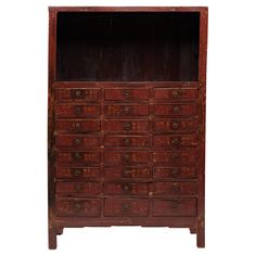 an old wooden dresser with many drawers