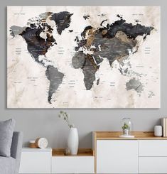 the world map is hanging in an empty room