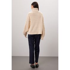 Off-white knit (66% Acrylic, 12% Polyester, 10% Nylon, 8% Wool, 4% Alpaca). Sweater. Long sleeves. Turtleneck. Pull on. 24" from shoulder to hemline. Imported. Oversized Cable Knit Sweater For Work, White Cable Knit Outerwear For Work, White Knit Top For Work In Winter, Chic Winter White Sweater For Cold Weather, Winter White Turtleneck Sweater For Work, Textured Knit Sweater For Winter Workwear, White Merino Wool Sweater For Fall, Spring Merino Wool Cable Knit Sweater, Spring Cable Knit Merino Wool Sweater