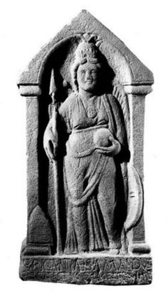 an old statue with a woman holding a cross