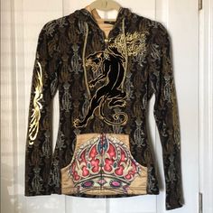 Christian Audigier Hooded Zip-Up Sweatshirt - Xs. Only Worn A Few Times. Great Condition. Lots And Lots Of Iconic Christian Audigier Details Throughout. Foil Graphics, Silky Gold Interior. Front Pocket Details. Panther On Front Is Felt. Gold Draw String On Hood. Zipper Has Ca Labeled Charm. See Photos. Fitted Hooded Graphic Hoodie, Fitted Hooded Hoodie With Graphic Print, Fitted Graphic Print Hoodie Top, Fitted Graphic Print Hoodie, Fitted Graphic Print Hooded Sweatshirt, Fitted Graphic Print Hoodie For Fall, Fitted Hoodie With Graphic Print For Fall, Sorel Caribou Boots, Crochet Romper