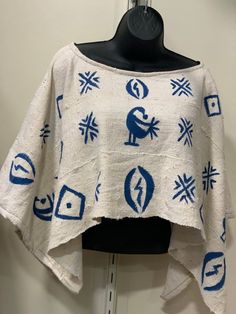 A blue and white mud cloth shrug with cowrie shell design. The  mud cloth poncho is a great way to wrap yourself up with  the mother land. Hand woven mud cloth shawl from Mali. A nice rustic natural wearable art piece. Order yours today. Traditional Blue One-size Poncho, Traditional Blue Poncho, Traditional White Poncho One Size, White One-size Traditional Poncho, Traditional Cotton Shawl For Beach, African Poncho, African Tops, African Skirts, Batik Fashion