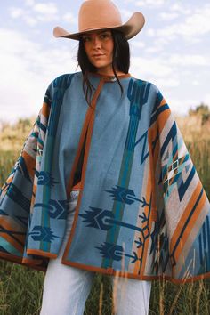 Bringing back the fun and sensible style of a cape, this will keep you just the right temperature while you’re out and about. Our cape is reversible, offering two wearing options displaying different hues of blue. Made with the Pendleton® Star Watchers wool blanket. Since ancient times, Native Americans have practiced astronomy to predict the arrival of the brightest stars. Mysterious medicine wheels in Wyoming and Canada track the rising of Aldebaran, Rigel and Sirius, inspiring this dynamic de