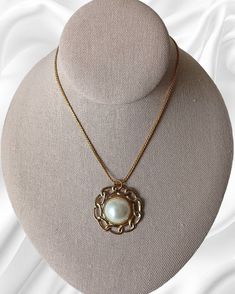 Vintage 1970's Monet Pearl Half Sphere Retro Design Pendant Gold Tone Necklace. This statement jewelry piece is elegant for formal, those dinner-dancing nights out, cruise wear or part of a work wardrobe. Classic in design with a chain measuring 18 inches in length unclasped, pendent measures 1 3/8 inches in diameter by 1/2 inches thick. This piece has some pealing on the back but is in overall good vintage condition. Vintage Pearl Pendant Necklace For Formal Occasions, Vintage Formal Necklace With Pearl Pendant, Vintage Pearl Pendant Jewelry For Evening, Retro Round Necklace For Formal Occasions, Formal Costume Jewelry Necklace With Pearl Pendant, Elegant Medallion Necklaces For Evening, Retro Round Necklaces For Formal Occasions, Sphere Design, Monet Necklace