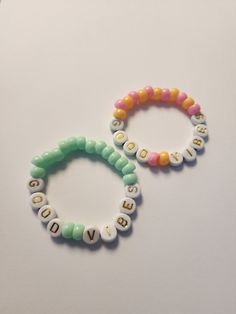 These Kandi bracelets are the perfect addition to your accessory collection! Each bracelet is customizable, allowing you to pick your own colors and words.  Key Features: - Customizable design - Vibrant colors - Perfect for festivals and events Choose from a variety of colors to create a unique and eye-catching accessory. These bracelets are perfect for festivals, concerts, or any event where you want to stand out from the crowd.  Express yourself with words or phrases that have special meaning Funny Bracelets, Bracelets Kandi, Bracelets Beads, Kandi Bracelets, Colorful Accessories, Kandy, Great Conversation Starters, Plastic Beads, How To Make Beads