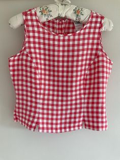 Laura Ashley best, vintage vest, 80's waistcoat, tunic top, gingham vest, vintage waistcoat, summer top, linen tunic, blouse, 80's clothing Cute vintage ladies vest top. Red and white gingham waistcoat style blouse top with back button fastening  Made by Laura Ashley in the late 80's in the U.K,. 100% linen In very good preloved vintage condition.  100% linen. Label shows UK size 12, but please check measurements. Measurements: Underarm to underarm 18" (46 cm) Shoulder to hem 19" (48 cm) Any questions please ask  Many thanks  BlossomBlueVintage 2024/08 Gingham Vest, Waistcoat Style, Vintage Waistcoat, Gingham Outfit, 80s Blouse, Ladies Vest, Vest Tops Women, 80s Outfit, Vintage Vest